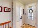 Bright foyer with tiled floors and a decorative wreath at 2419 Daisy Dr, North Port, FL 34289