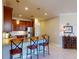Well-lit kitchen with granite countertops, stainless steel appliances, and pendant lighting above the breakfast bar at 2419 Daisy Dr, North Port, FL 34289