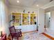 Bright office featuring custom built-in shelves, light walls, and a bright window for natural lighting at 2419 Daisy Dr, North Port, FL 34289