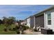 Outdoor patio area with comfortable seating and mature landscaping, perfect for entertaining at 24313 Westgate Blvd, Punta Gorda, FL 33980