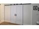 Charming interior of the property featuring sliding white barn doors at 24313 Westgate Blvd, Punta Gorda, FL 33980