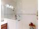Bathroom featuring a shower with glass surround and white tile at 24313 Westgate Blvd, Punta Gorda, FL 33980