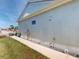 Side view of the home exterior and walkway at 24313 Westgate Blvd, Punta Gorda, FL 33980