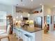 Beautiful open concept kitchen with island seating, pendant lighting and stainless steel appliances at 24313 Westgate Blvd, Punta Gorda, FL 33980
