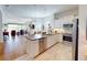 Bright, open kitchen flowing into the living area, equipped with stainless steel appliances and a functional island at 24313 Westgate Blvd, Punta Gorda, FL 33980