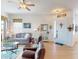 Cozy living room with hardwood floors, comfortable seating, and inviting decor creates a warm, welcoming space at 24313 Westgate Blvd, Punta Gorda, FL 33980