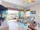 Bright living room with a waterfront view, sliding glass doors and coastal decor at 24313 Westgate Blvd, Punta Gorda, FL 33980