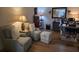 Comfortable living room featuring seating area with matching accent chairs at 24313 Westgate Blvd, Punta Gorda, FL 33980