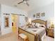 Spacious main bedroom with a barn door leading to the bathroom and ample closet space at 24313 Westgate Blvd, Punta Gorda, FL 33980