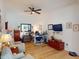 Cozy home office featuring hardwood flooring, a ceiling fan, and comfortable furnishings at 24313 Westgate Blvd, Punta Gorda, FL 33980
