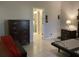 The primary bedroom has neutral walls, tile floor, a dark dresser, and a bathroom entrance at 244 Surinam St, Punta Gorda, FL 33983