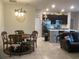 Cozy dining area adjacent to the kitchen, featuring a round table with chairs and modern lighting at 244 Surinam St, Punta Gorda, FL 33983