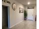 The spacious foyer with neutral walls provides a warm welcome, complemented by stylish decor at 244 Surinam St, Punta Gorda, FL 33983