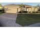 Charming single-story home featuring a two-car garage, brick paved driveway, and well-maintained landscaping at 244 Surinam St, Punta Gorda, FL 33983