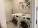 Laundry room equipped with modern LG washer and dryer units, complemented by shelving at 244 Surinam St, Punta Gorda, FL 33983