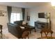 Open-concept living room with a large window, comfortable seating, and neutral decor at 244 Surinam St, Punta Gorda, FL 33983
