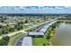 A high aerial view of the community and surrounding neighborhood by a lake at 25225 Rampart Blvd # 1604, Punta Gorda, FL 33983