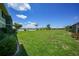 Expansive green lawn, a scenic lake view from this meticulously maintained backyard at 25225 Rampart Blvd # 1604, Punta Gorda, FL 33983