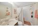 Bathroom featuring a shower with nautical accents, a sink with counter space, and soft lighting at 25225 Rampart Blvd # 1604, Punta Gorda, FL 33983