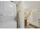 Bathroom with a stacked washer and dryer plus shower and tub at 25225 Rampart Blvd # 1604, Punta Gorda, FL 33983