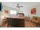 Comfortable bedroom with ceiling fan, window and furnishings creates a cozy, inviting atmosphere at 25225 Rampart Blvd # 1604, Punta Gorda, FL 33983
