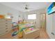Bright bedroom with beach-themed decor, cheerful colors, and ample storage; a delightful, sunny retreat at 25225 Rampart Blvd # 1604, Punta Gorda, FL 33983