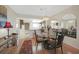 Bright dining area featuring a glass table, chandelier, and convenient access to kitchen at 25225 Rampart Blvd # 1604, Punta Gorda, FL 33983