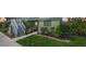 Exterior view of a condo unit with a well manicured lawn and shrubs surrounding the building at 25225 Rampart Blvd # 1604, Punta Gorda, FL 33983