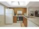 Bright kitchen features wood cabinets and stainless steel appliances at 25225 Rampart Blvd # 1604, Punta Gorda, FL 33983