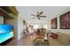 Open-concept living room with hardwood floors, modern decor, and abundant natural light at 25225 Rampart Blvd # 1604, Punta Gorda, FL 33983