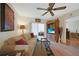 Inviting living room featuring a comfortable sofa, entertainment center, and sliding door with natural light at 25225 Rampart Blvd # 1604, Punta Gorda, FL 33983