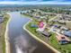 Aerial view of waterfront home with a private pool and access to a scenic waterway at 26373 Madagascar, Punta Gorda, FL 33983