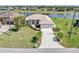 Aerial view of a beautiful home surrounded by lush landscaping and a serene waterfront at 26373 Madagascar, Punta Gorda, FL 33983