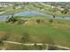 Picturesque aerial view showcasing the sprawling golf course with tranquil water features and meticulously maintained fairways at 26373 Madagascar, Punta Gorda, FL 33983