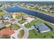 Waterfront neighborhood view showcasing mature landscaping and waterfront access for many homes at 26373 Madagascar, Punta Gorda, FL 33983