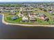 Picturesque waterfront community with spacious properties, lush greenery, and a tranquil atmosphere at 26373 Madagascar, Punta Gorda, FL 33983
