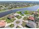 Waterfront homes boasting private pools, manicured lawns, and access to a tranquil lake at 26373 Madagascar, Punta Gorda, FL 33983