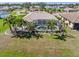 Gorgeous lakefront property with screened pool, mature palms and well manicured lawn at 26373 Madagascar, Punta Gorda, FL 33983