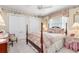 This is a traditionally decorated bedroom with a pink and white color palette at 26373 Madagascar, Punta Gorda, FL 33983