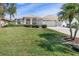 Charming single-story home featuring a well-manicured lawn and two-car garage, blending comfort and curb appeal at 26373 Madagascar, Punta Gorda, FL 33983