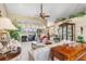 Spacious living room with views of the water, large windows, and elegant furnishings, ideal for relaxation at 26373 Madagascar, Punta Gorda, FL 33983