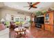 Inviting living room with large windows, comfortable seating, and stylish decor at 26373 Madagascar, Punta Gorda, FL 33983
