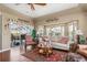 Comfortable living room with an open layout, neutral tones, and views of the screened lanai at 26373 Madagascar, Punta Gorda, FL 33983