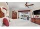 This main bedroom is traditionally decorated with a lovely color palette and a sliding glass door to the pool area at 26373 Madagascar, Punta Gorda, FL 33983