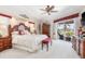 Large main bedroom featuring a king-size bed, elegant furnishings, and access to the patio at 26373 Madagascar, Punta Gorda, FL 33983
