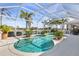 Tranquil screened pool area with lush tropical landscaping, offering ultimate relaxation and privacy at 26373 Madagascar, Punta Gorda, FL 33983