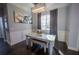 Elegant dining room with wood floors, modern lighting, and wainscoting accents at 282 Shaefer St, Port Charlotte, FL 33953