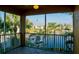 Screened-in balcony showcasing serene water views and lush landscaping at 3216 Purple Martin Dr # 121, Punta Gorda, FL 33950