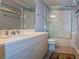 Well-lit bathroom featuring a vanity sink, mirror, and glass-enclosed shower at 3216 Purple Martin Dr # 121, Punta Gorda, FL 33950