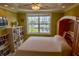 Bright bedroom with water view, built-in bookshelves, and a Murphy bed at 3216 Purple Martin Dr # 121, Punta Gorda, FL 33950